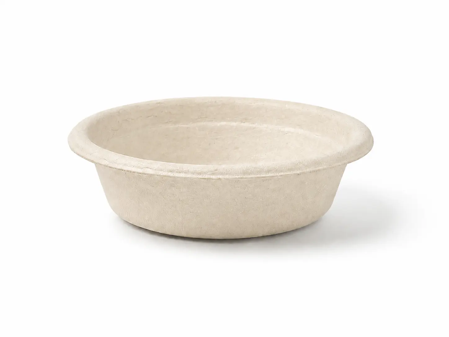 1oz Molded Fiber Sauce Cup Angled Front View Angled front view of a natural-color 1oz Molded Fiber Sauce Cup showing its round opening, flanged rim, shallow tapered wall, and molded-fiber texture