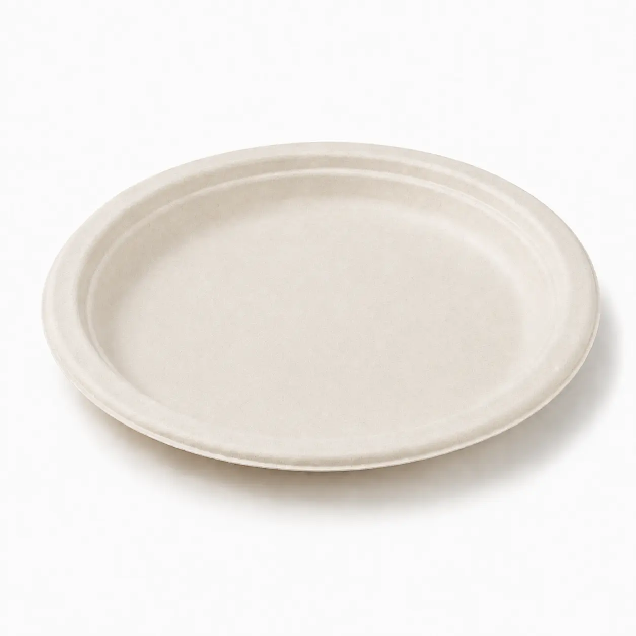 7-Inch Sugarcane Bagasse Round Plate Angled Top View Angled top view of a natural-color 7-Inch Sugarcane Bagasse Round Plate with a smooth serving area and raised circular rim