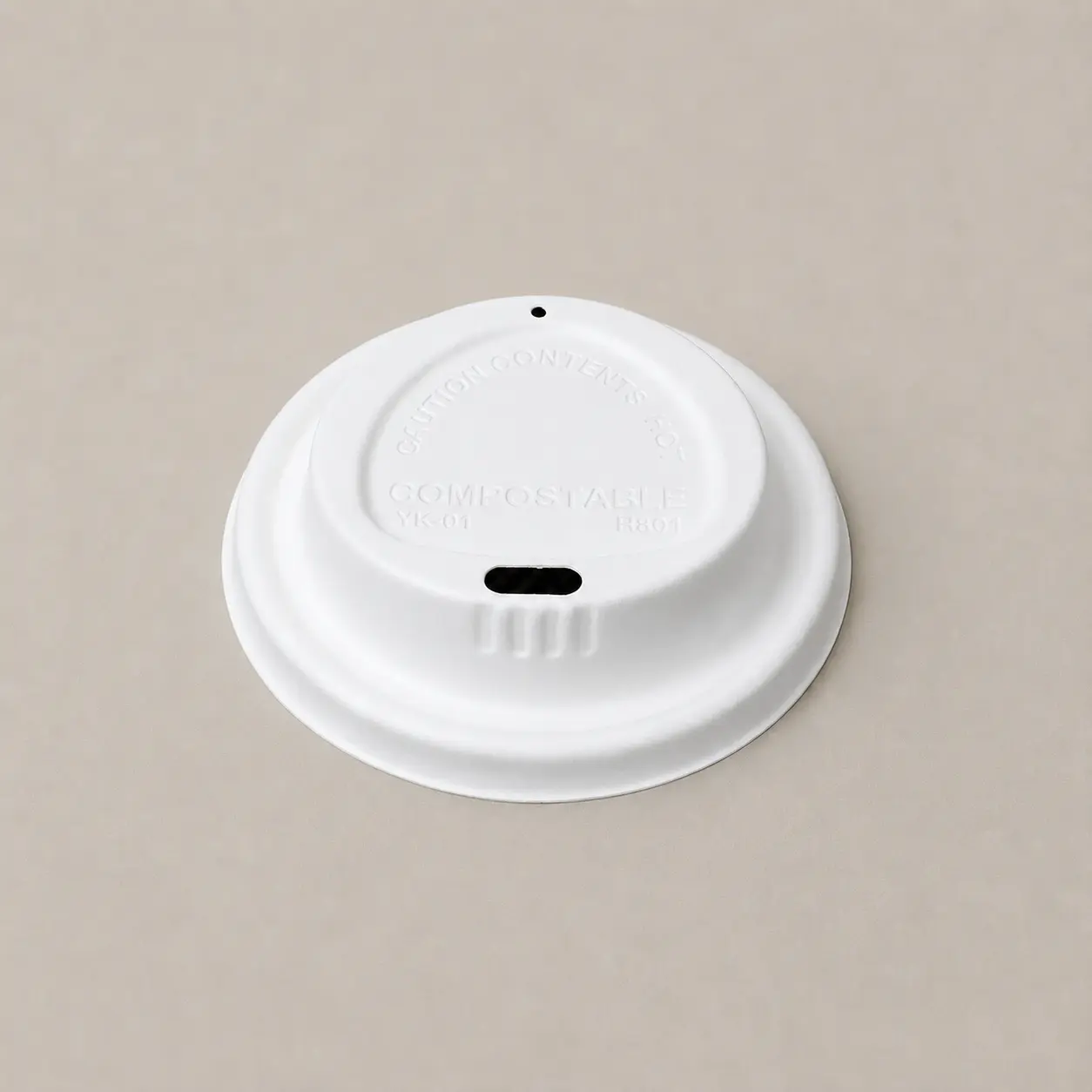 80mm Triangle-Design Molded Fiber Hot Cup Lid Product View Front view of a white 80mm triangle-design molded fiber hot cup lid with a raised drinking section and separate vent hole