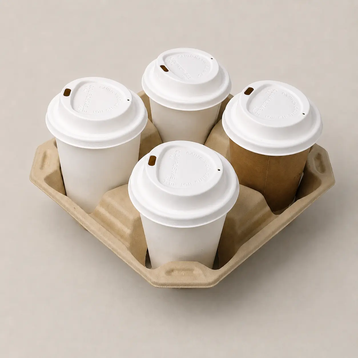 80mm Triangle-Design Molded Fiber Hot Cup Lids in Four-Cup Carrier Four takeaway cups fitted with white 80mm triangle-design molded fiber hot cup lids in a molded fiber drink carrier