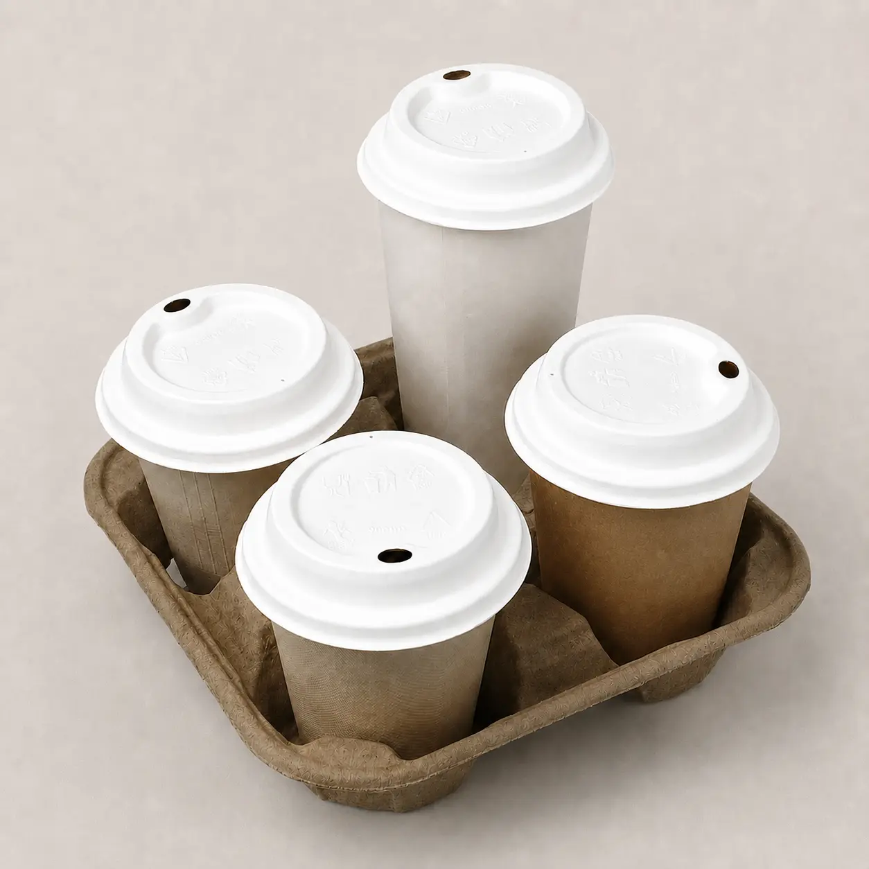 90mm Molded Fiber Hot Cup Sip Lids in Four-Cup Carrier Four takeaway cups fitted with white 90mm molded fiber hot cup sip lids in a molded fiber four-cup drink carrier