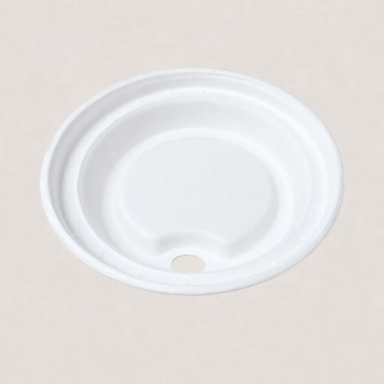 90mm Molded Fiber Hot Cup Sip Lid Underside Underside view of a white 90mm molded fiber hot cup sip lid showing its inner texture and molded cup-rim channel