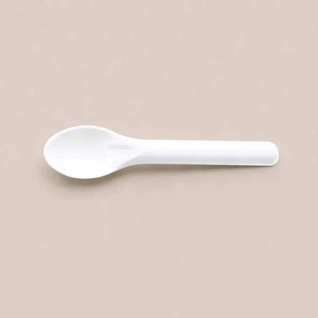 Horizontal view of a white 6-Inch Molded Fiber Spoon KPS-02 showing its concave serving surface, reinforced neck, and straight rounded handle