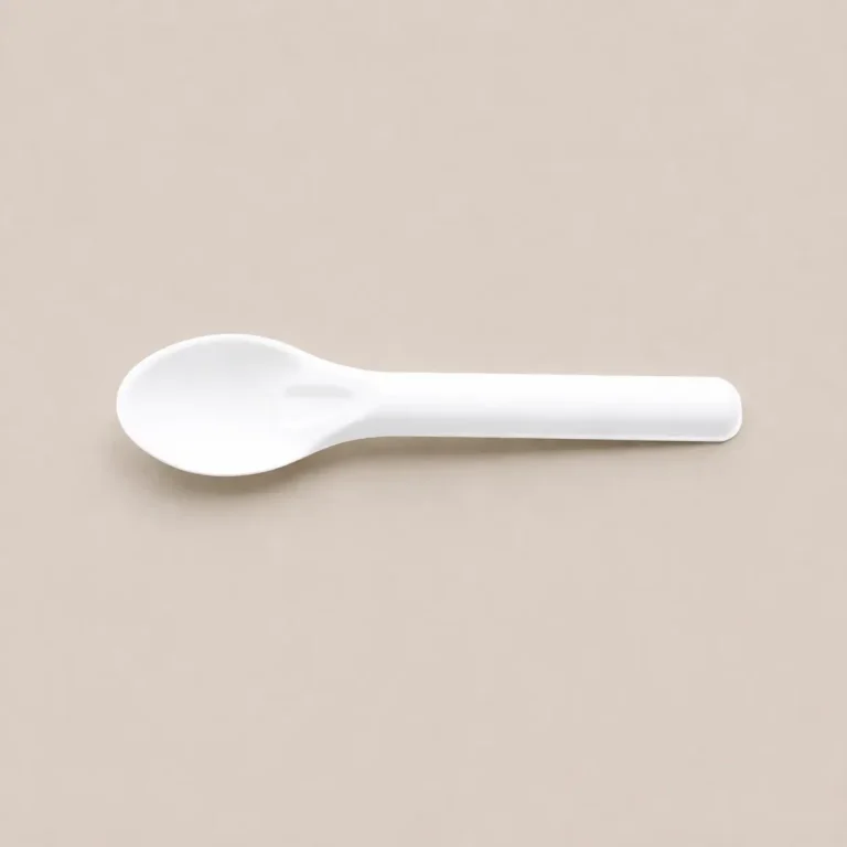 Horizontal view of a white 6-Inch Molded Fiber Spoon KPS-02 showing its concave serving surface, reinforced neck, and straight rounded handle