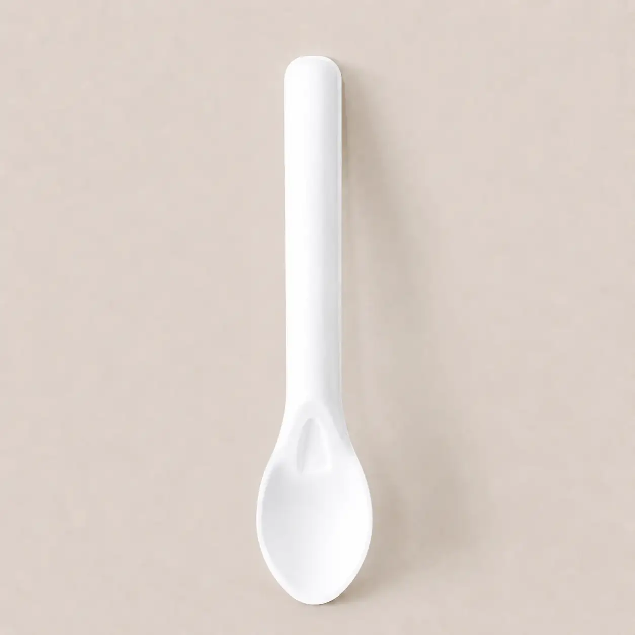 6-Inch Molded Fiber Spoon KPS-02 Vertical View Vertical view of a white 6-Inch Molded Fiber Spoon KPS-02 showing its rounded handle, molded neck detail, and concave serving end