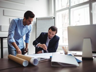 interior-designer-working-on-blueprint-with-cowork-scaled.jpg